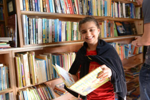 Kirkman Park Elementary School student Aghader Yassen looks at books at Used Pages book store.
