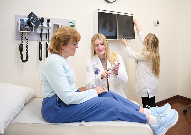 PharmD student practicing patient care in the Standardized Client Program at the Fred Wilson School of Pharmacy at HPU